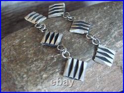 Navajo Sterling Silver Ribbed Post Earrings by Tahe